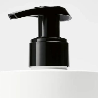 Shop Rescue Spa Tulipmania Hand Lotion with black pump dispenser and white bottle. Notes of freesia, tulip, and blonde woods.