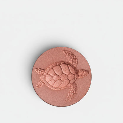 Shop Rescue Spa Turtle Grace refill pan blush in deep apricot with embossed turtle design. Finely milled powder.