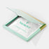 Shop Rescue Spa Valmont Regenerating Collagen Mask Treatment in a light green open box on a black background.