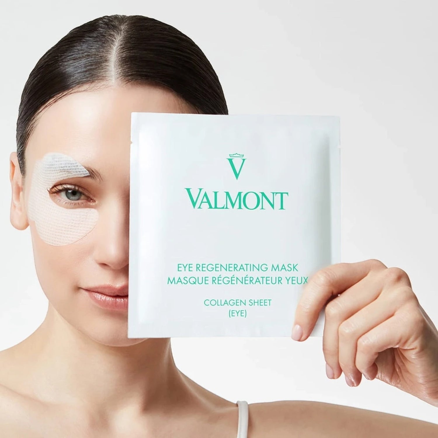 Shop Rescue Spa Valmont Eye Regenerating Mask collagen sheet on model to reduce puffiness and smooth fine lines