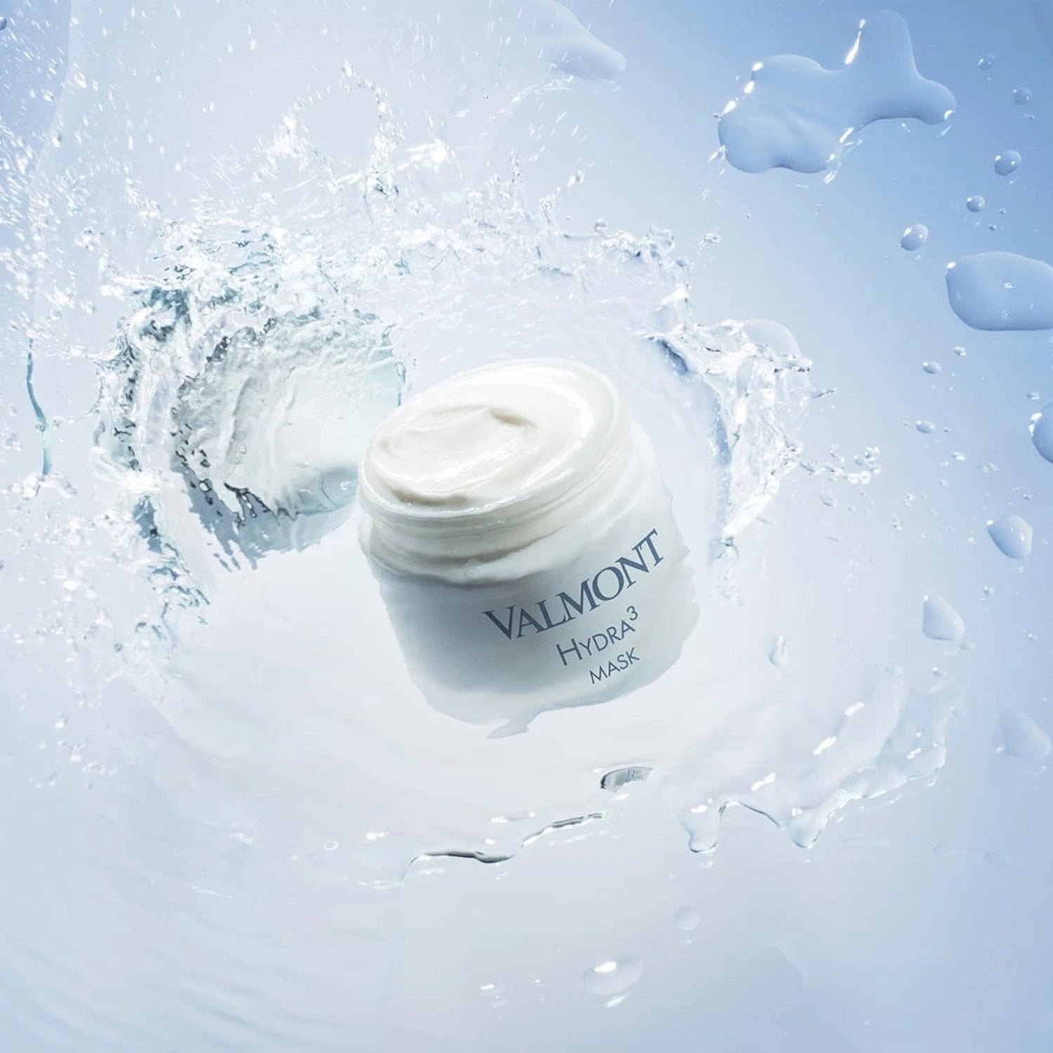 Shop Rescue Spa Valmont Hydra3 Mask in a white jar surrounded by a refreshing water splash effect.
