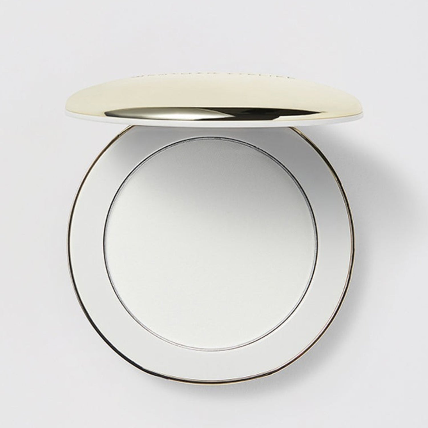 Shop Rescue Spa Vital Pressed Skincare translucent powder in a sleek, round gold-trimmed compact case.
