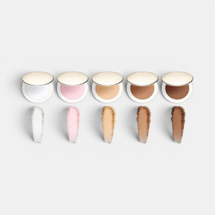Shop Rescue Spa Vital Pressed Skincare powder compacts in Translucent, Pink Bubble, Crème, Dune, and Café shades. Swatches show sheer coverage.