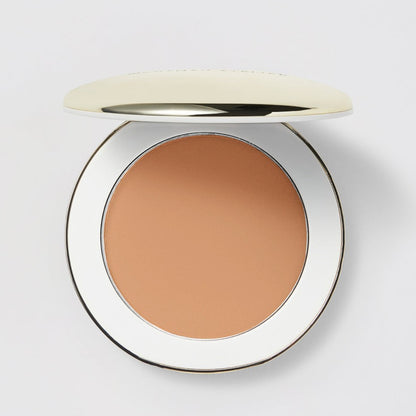 Shop Rescue Spa Vital Pressed Skincare powder in a tan shade, featuring a sleek compact with a gold lid.