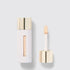 Shop Rescue Spa Westman Atelier Vital Skincare Concealer in a white bottle with a gold cap and doe-foot applicator