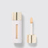 Shop Rescue Spa Westman Atelier Vital Skincare Concealer in a white bottle with a gold cap and doe-foot applicator.