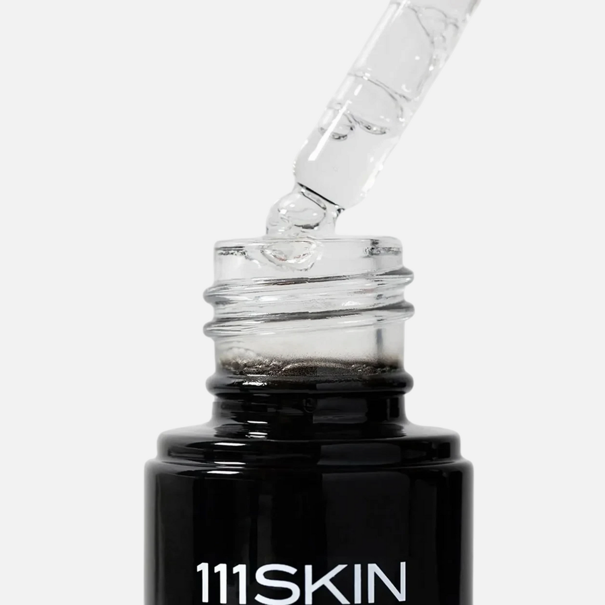 Shop Rescue Spa Black Diamond Vitamin C Brightening Booster serum in a black glass bottle with a clear dropper