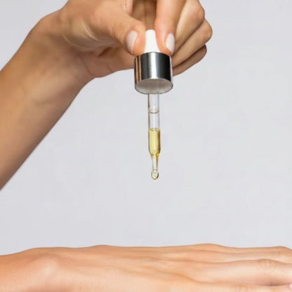 Shop Rescue Spa iS Clinical Super Serum Advance+ Vitamin C serum being applied with a glass dropper to skin