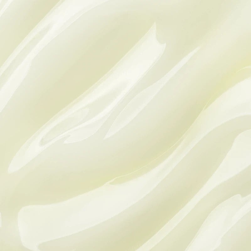 Shop Rescue Spa Vitamin C serum texture showing a smooth, creamy, pale yellow skincare formula.