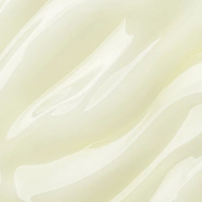 Shop Rescue Spa Vitamin C serum texture showing a smooth, creamy, pale yellow skincare formula.