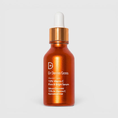 Shop Rescue Spa Dr Dennis Gross Vitamin C Lactic 15% Firm &amp; Bright Serum in an orange glass dropper bottle.