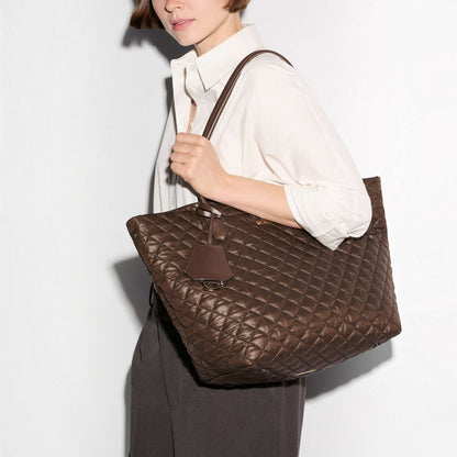 Shop Rescue Spa walnut brown quilted nylon daily tote bag with Italian leather handles carried on a woman&