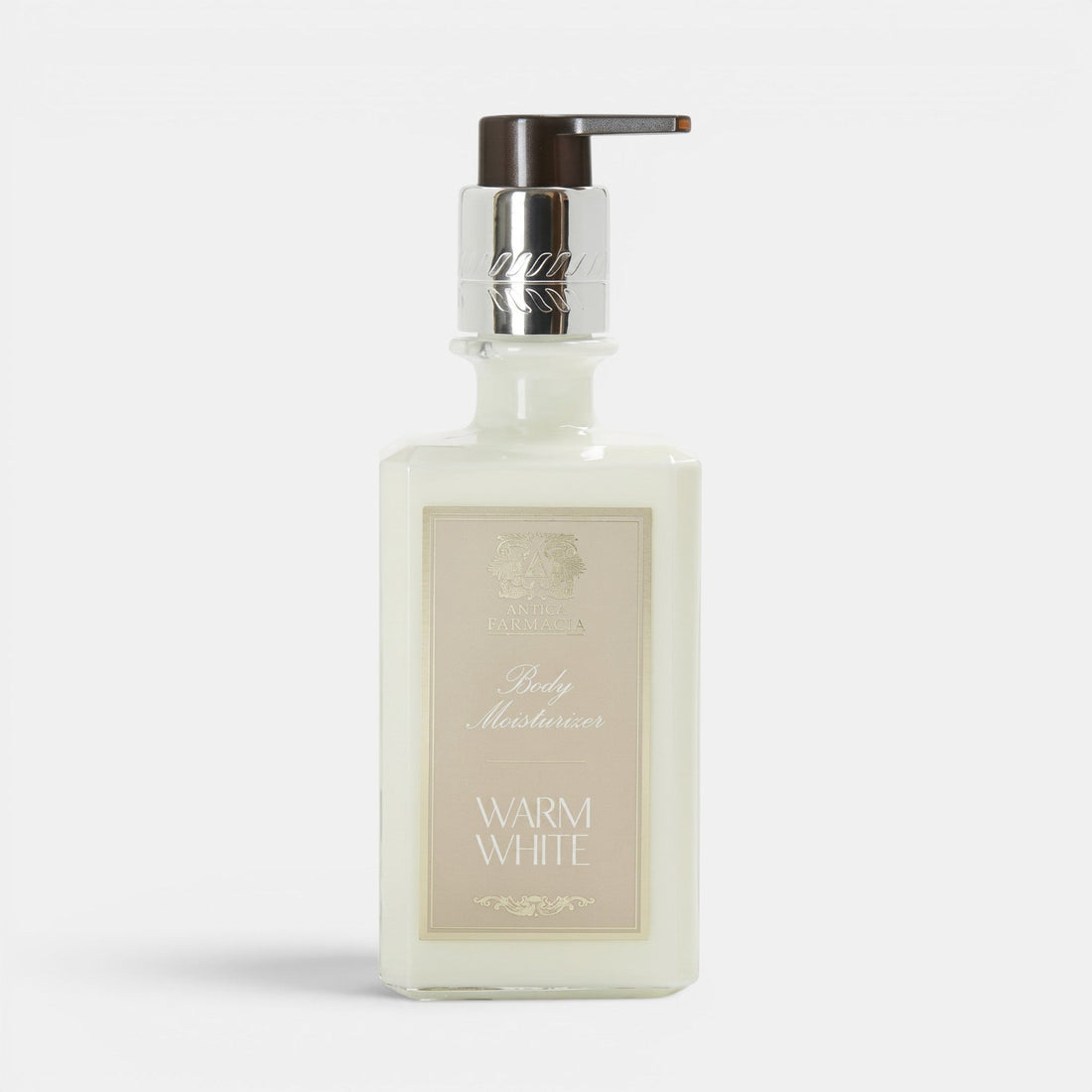 Shop Rescue Spa Warm White body moisturizer in a clear glass bottle with a silver pump dispenser