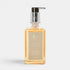 Shop Rescue Spa Warm White hand and body wash in a clear rectangular bottle with a silver pump dispenser.