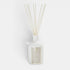 Shop Rescue Spa Antica Warm White reed diffuser in an elegant matte white apothecary bottle with natural reeds.