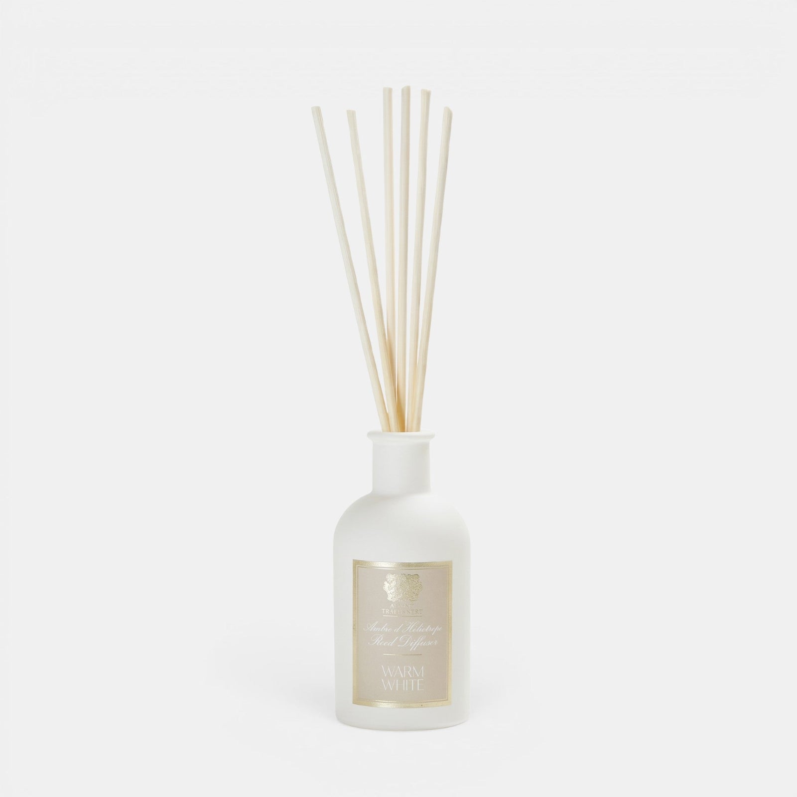 Shop Rescue Spa Warm White reed diffuser in a frosted white glass bottle with natural rattan reeds.