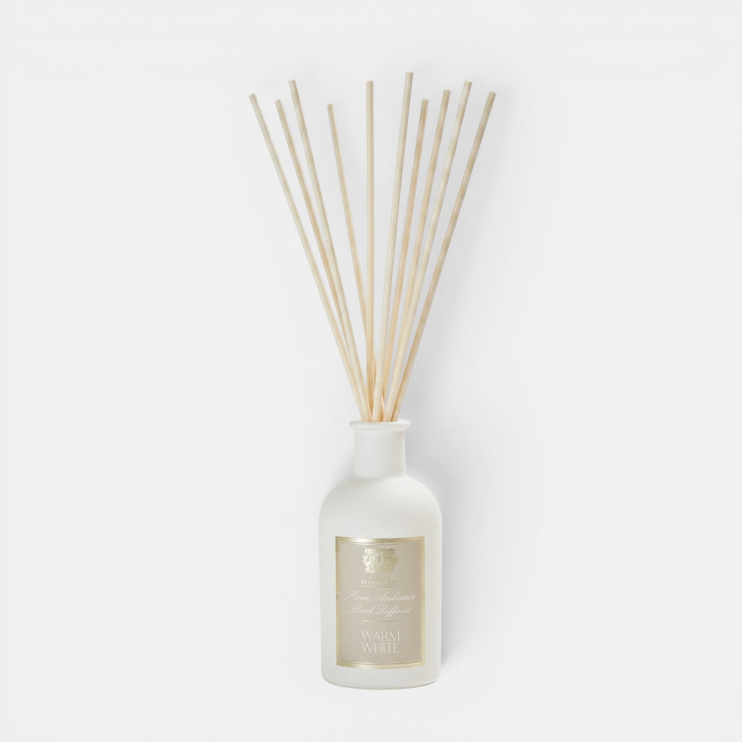 Shop Rescue Spa Warm White reed diffuser in a white apothecary-style glass bottle with natural wooden reeds.