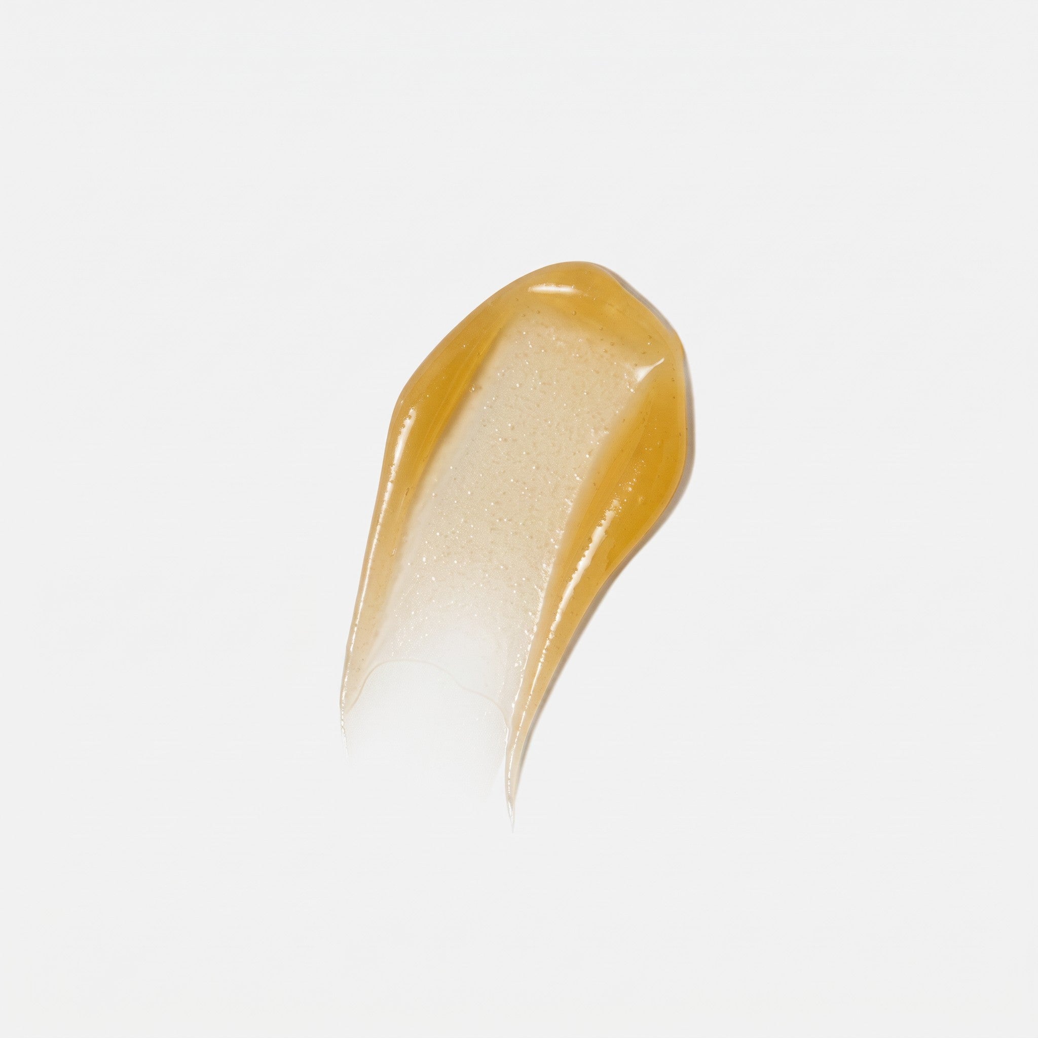 Shop Rescue Spa Warming Honey Cleanser gel texture showing a rich, golden, honey-like consistency for face cleansing.