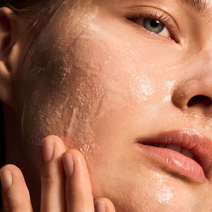 Shop Rescue Spa Warming Honey Cleanser applied as a rich, golden gel texture on a woman&