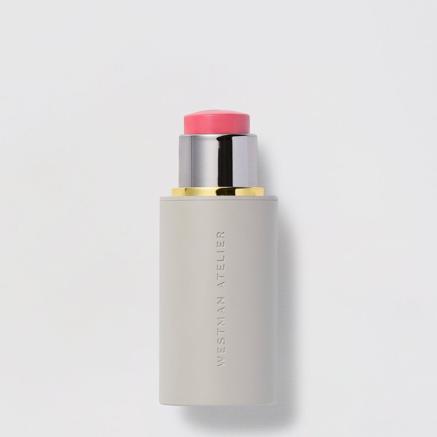 Shop Rescue Spa Westman Atelier Baby Cheeks Blush Stick in a creamy pink shade with a sleek grey twist-up tube