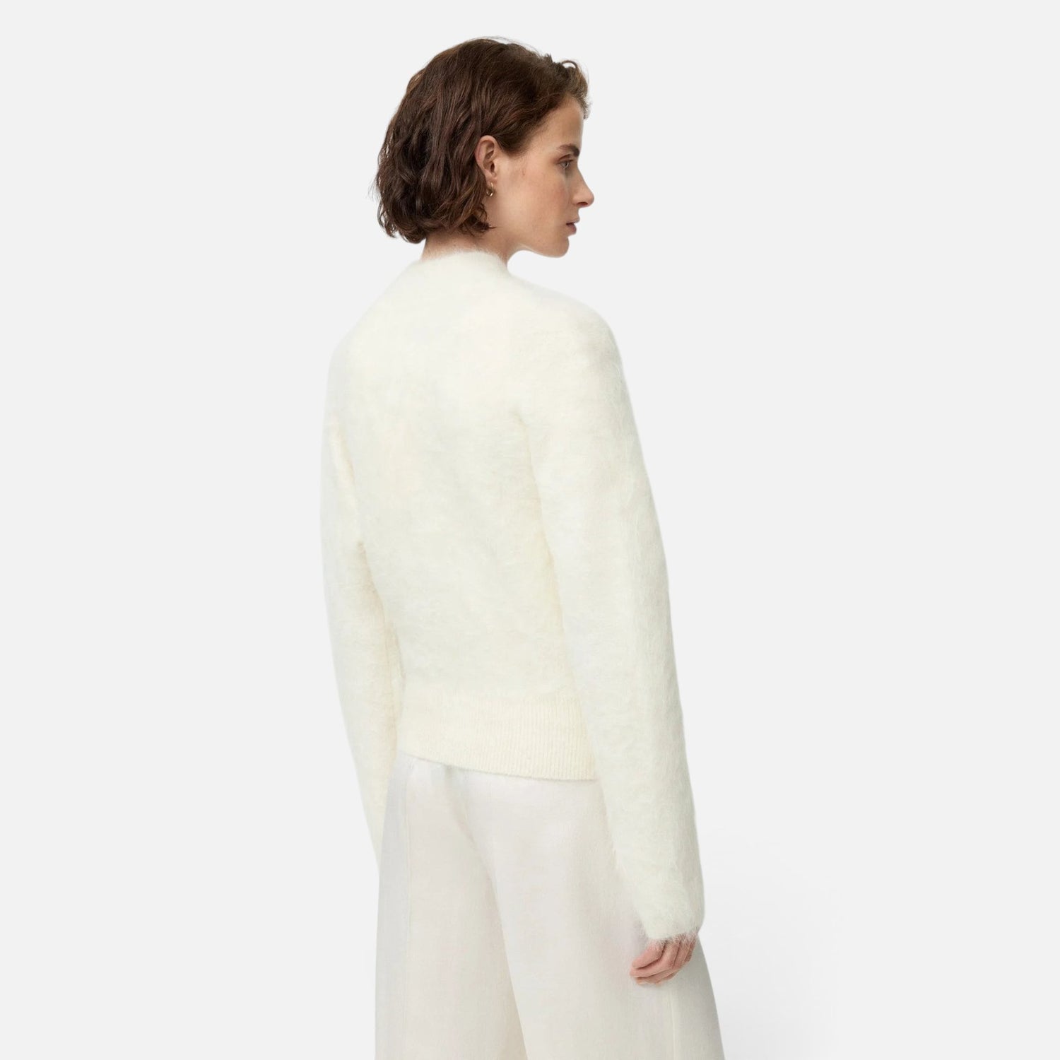 Shop Rescue Spa white alpaca blend slim fit zip cardigan worn by a model, back view