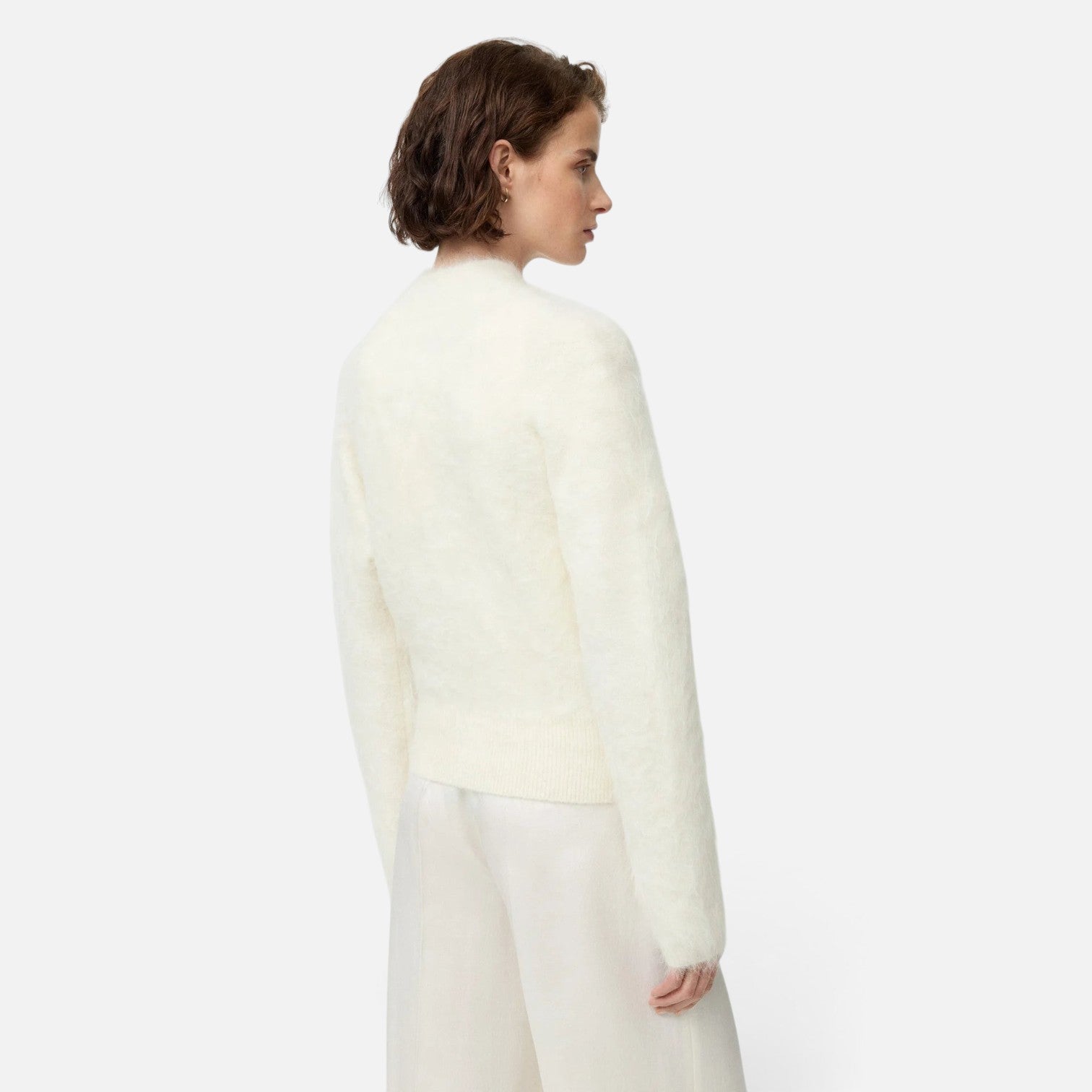 Shop Rescue Spa white alpaca blend slim fit zip cardigan worn by a model, back view