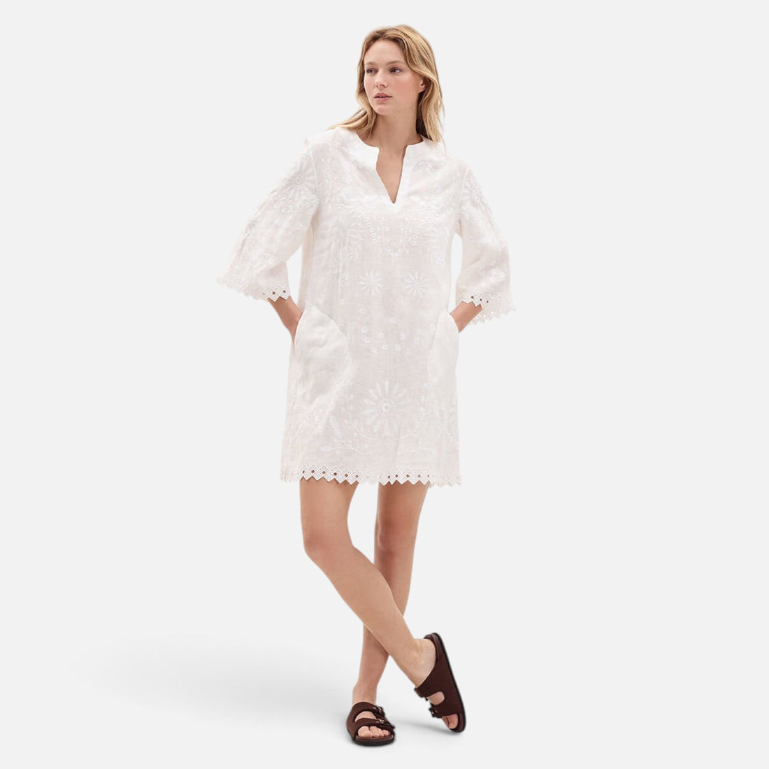 Shop Rescue Spa Aigue-Marine white embroidered linen short dress with V-neck and 3/4 sleeves on a model