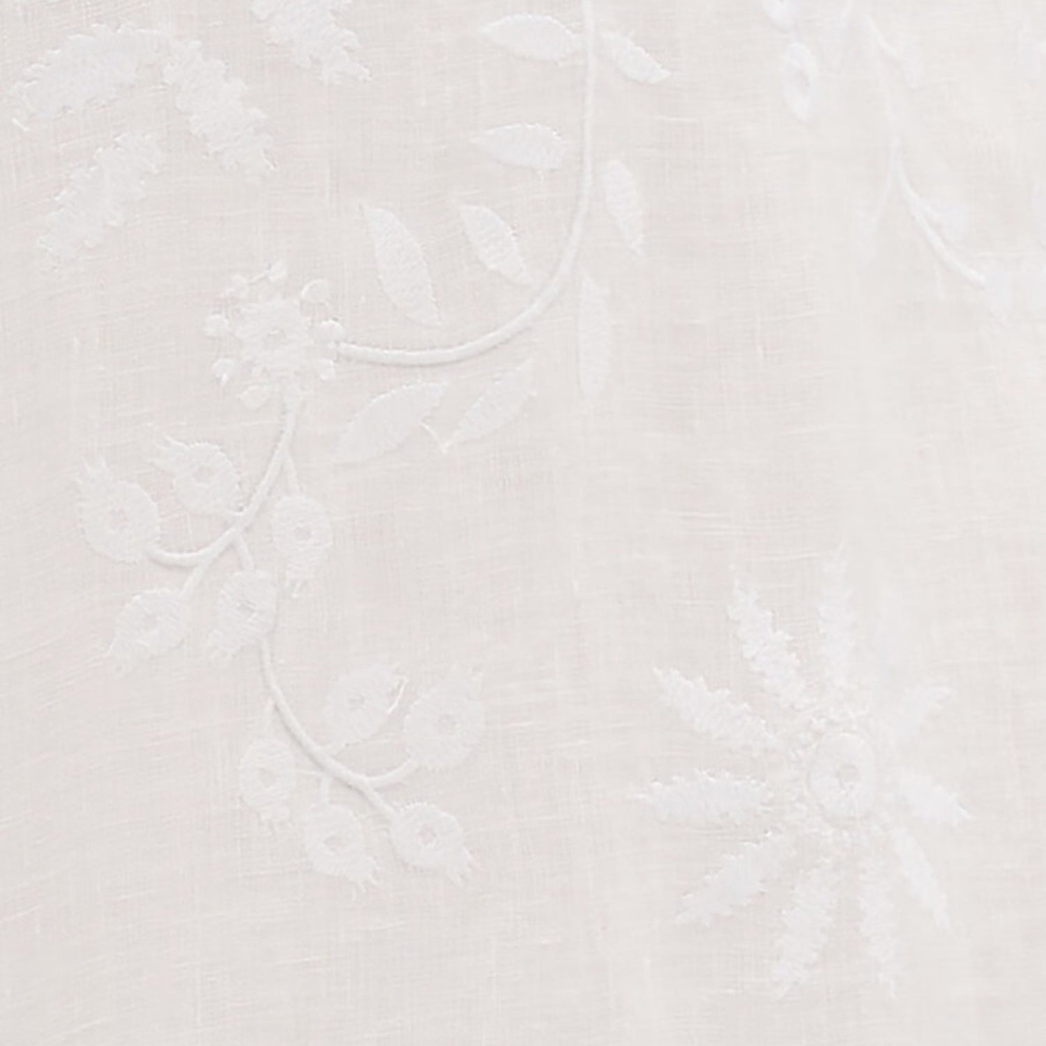 Shop Rescue Spa white linen fabric featuring delicate floral embroidery and artisanal hand-finished details.