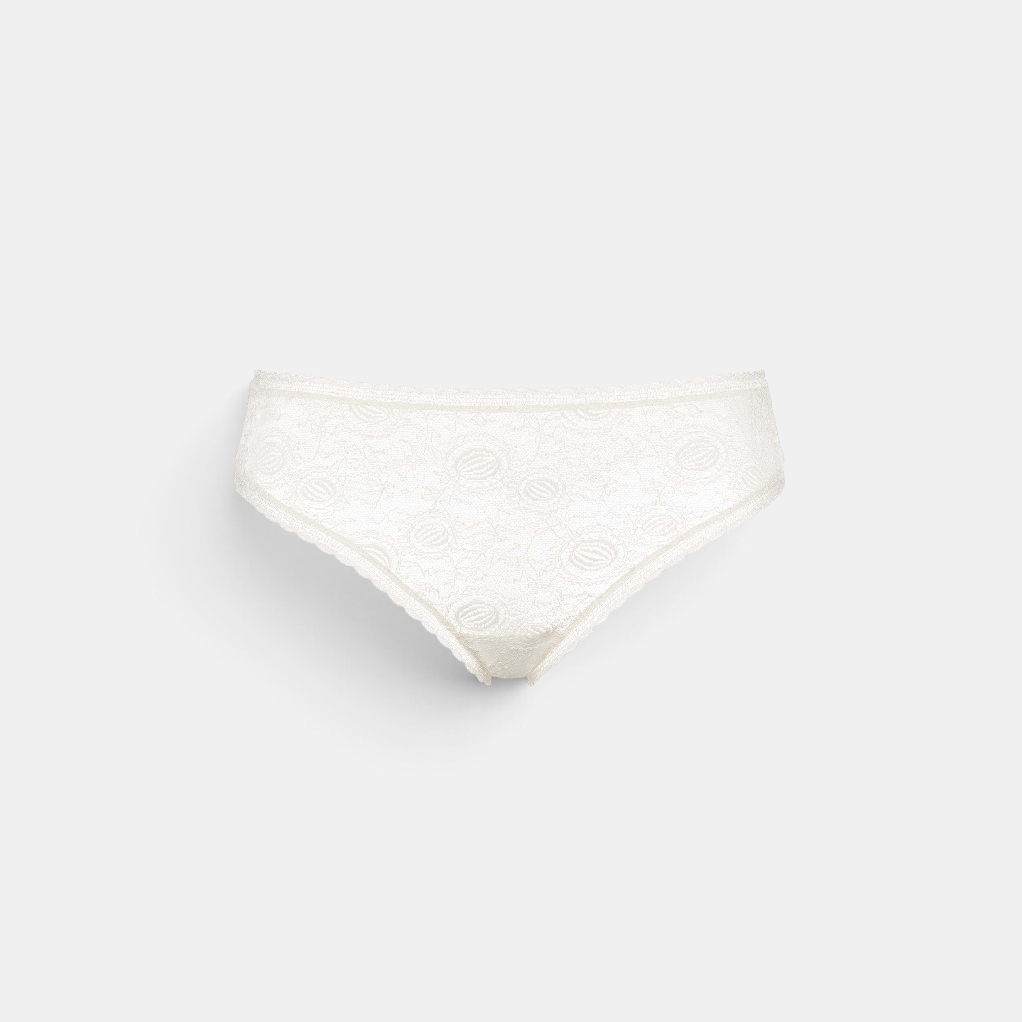 Shop Rescue Spa Citrine Lys white lace tanga panty with delicate floral embroidery and scalloped edges.