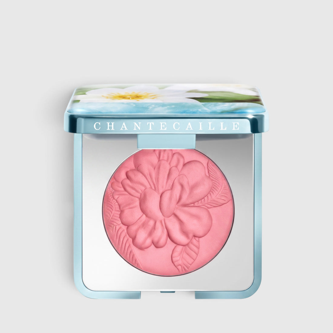 Shop Rescue Spa Wild Meadows Blush in Apple Blossom, a soft pink powder with a floral embossed design in a compact.