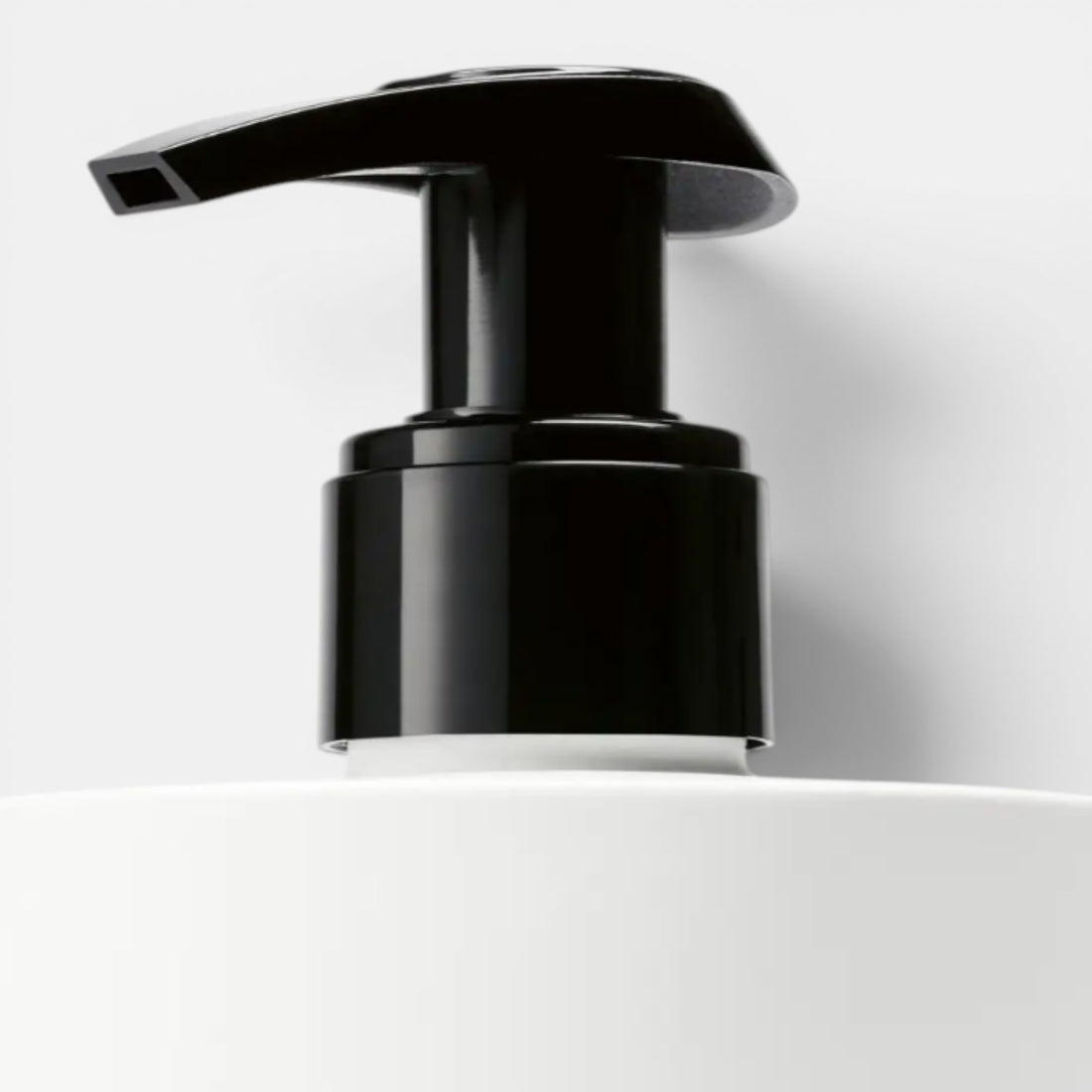 Shop Rescue Spa Yuzu Tree Hand Lotion with black pump dispenser on white bottle. Citrus scent.