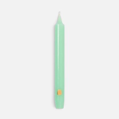 Shop Rescue Spa Madeleine taper candle in light green wax with a small gold emblem detail on a plain white background.