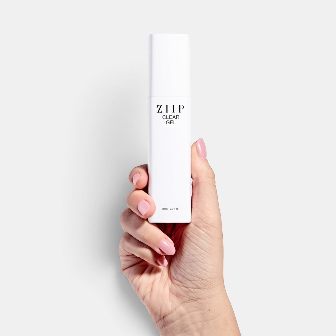 ZIIP Clear Gel bottle held in a hand against a white background